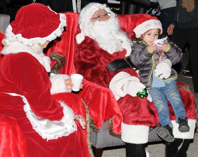 On Friday, December 14th at the Greenfield Care Center located at 118 B St. in Fillmore they hosted their Christmas Tree Lighting Ceremony. From 6pm – 9pm employees, their families and everyone from the community was welcomed to come and enjoy jolly jumpers, games, hot chocolate/ coffee, craft & food vendors, music and more. Even Santa & Mrs. Claus made an appearance. The event was hosted by the Fillmore Country Club & Greenfield Care Center. Pictured is some of Greenfield Care Center staff along with their kids enjoying the festivities. 