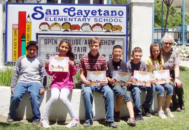 Carol Peterson, seated right, a Forest Ranger and Education Coordinator for the Channel Island National Park came to San Cayetano to speak to the students about what a good citizen is and how displaying good character could enrich the students and others in the community around them.