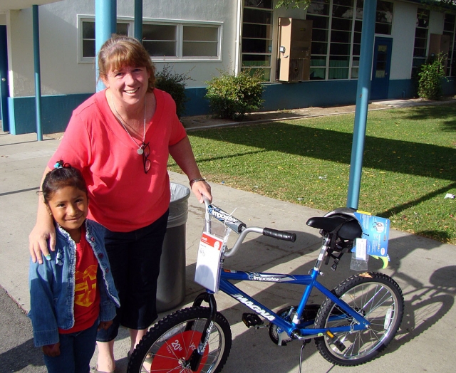 Kindergartener, Marlene Hernandez Cruz won a bicycle for All Year Perfect Attendance.
