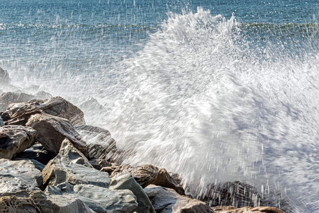 Photo of the Week "King Tide wave crashing on boulders at Faria County Park" By Bob Crum. Photo data: Canon 7DMKII camera, Tamron 16-300mm lens @57mm. Exposure; ISO 200, aperture f/32, 1/40th second shutter speed.