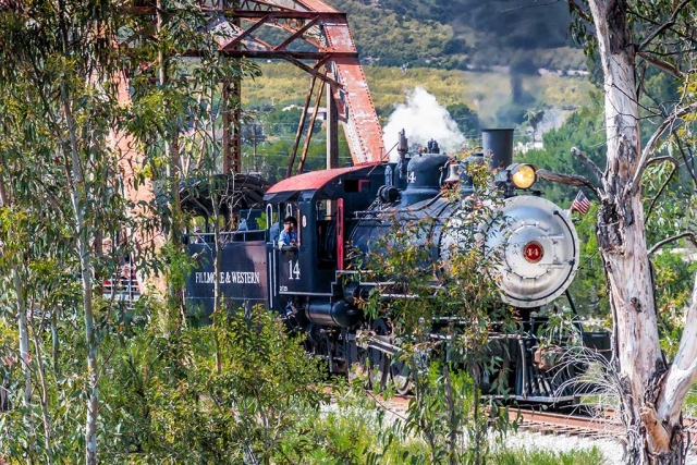 Photo of the Week "Steam Engine #14 exiting the Sespe Creek Trestle bridge during Railfest" By Bob Crum. Canon 7D MarkII camera, ISO 1000, Tamron 16-300mm lens @87mm, aperture f/11, 1/200 second shutter speed.