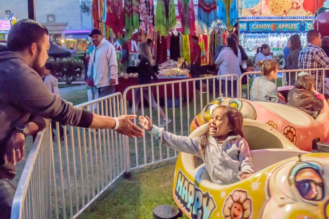 Photo of the Week "Girl and father both enjoying the experience" by Bob Crum. Photo data: Camera Canon 7D MKII Manual mode, ISO 10,000, Tamron 16-300mm lens @ 28mm, aperture f/11, shutter speed 1/125 second. 