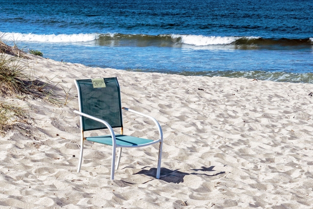 Photo of the Week "Beach chair reserved... use at risk!" By Bob Crum. Photo data: Canon 7D MKII camera, ISO 640, Tamron 16-300mm lens @ 35mm, aperture f16, shutter speed 1500 second.