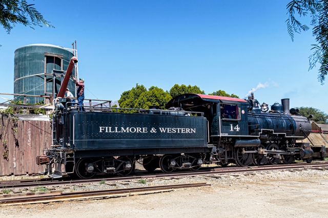 Photo of the Week: "Baldwin #14 gets a drink at the Loose Caboose" by Bob Crum. Photo data: Canon 7DMKII, manual mode, Tamron 16-300mm lens @16mm. Exposure; ISO 500, aperture f/11, 1/400 second shutter speed.