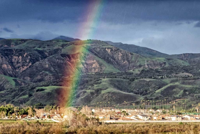Photo of the Week, by Bob Crum; One end of a rainbow lands in Fillmore right in the middle of a home owner's back yard. I chased it but by the time I got there... it disappeared... along with the pot of gold. Were it not for bad luck, I'd have no luck at all. Nevertheless, ain't rainbows wonderful? Did you notice the steaks in the photo upper right? Rain! Particulars: manual mode, 16-300mm lens at 73mm, aperture f/14, 1/60 of a sec shutter speed, ISO 800.
