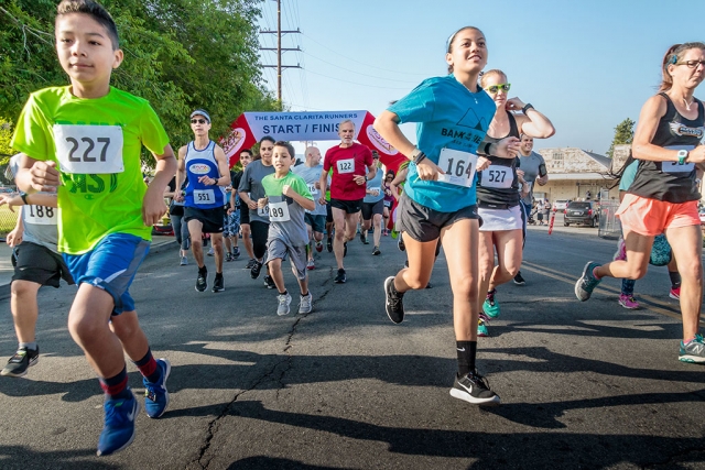 Photo of the Week "Stampede of Runners for 5K, 10K race" by Bob Crum. Photo data: Canon 7DMKII camera, ISO 800, Tamron-16-300mm lens @ 16mm, aperture f/11, shutter speed 1/500 second.