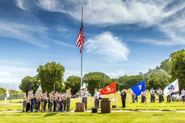 Photo of the Week by Bob Crum. Memorable Day ceremony, raising the flag, at the Bardsdale Cemetery. Photo data: Manual mode, ISO 160, 16-300mm lens at 18mm, f/11 at 1/250 second.