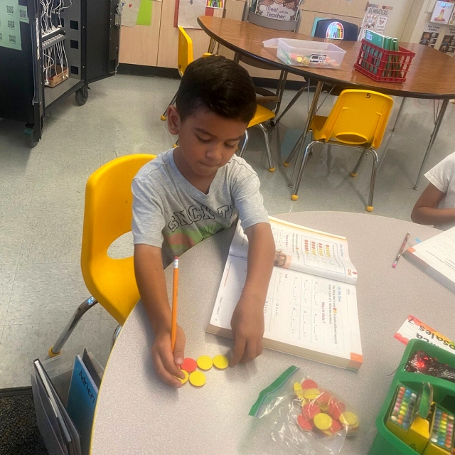 (above and below) Another exciting week at Piru School! Students in Mr. Barrera, Mrs. Herrera and Mrs. Lanning’s classrooms use manipulatives to support math fluency, addition, counting collections, and a special visit from (l-r) Board Clerk Olivia Palacio and Board President Tricia Gradias. Photos courtesy blog.fillmoreusd.org