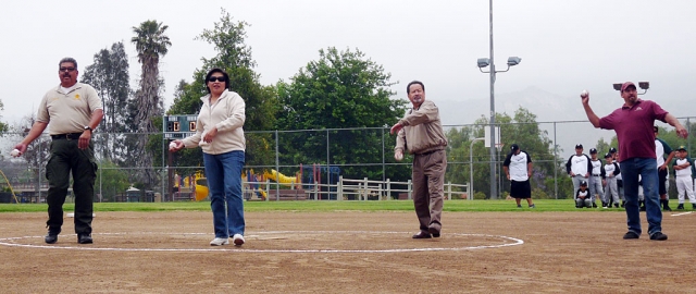 Above Danny Ramirez, Katina Aguilar, Gil Escoto, and Fernando Vancini throw out the first pitch at Piru’s Opening Ceremonies. Below players and their coach’s are introduced before game time. Photos courtesy of Heritage Valley Studios.