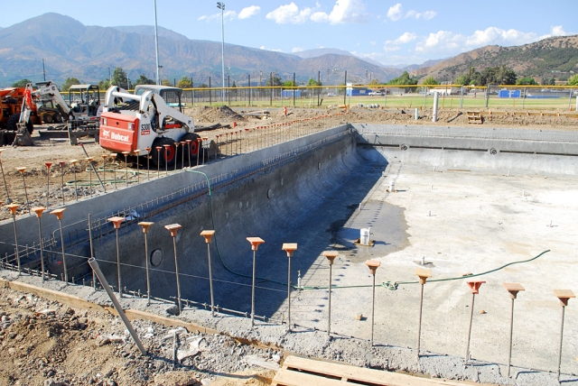 Above, Fillmore’s new swimming pool, almost ready for the plaster coat. Our new swimming complex will include a tennis court and special area for child recreation.