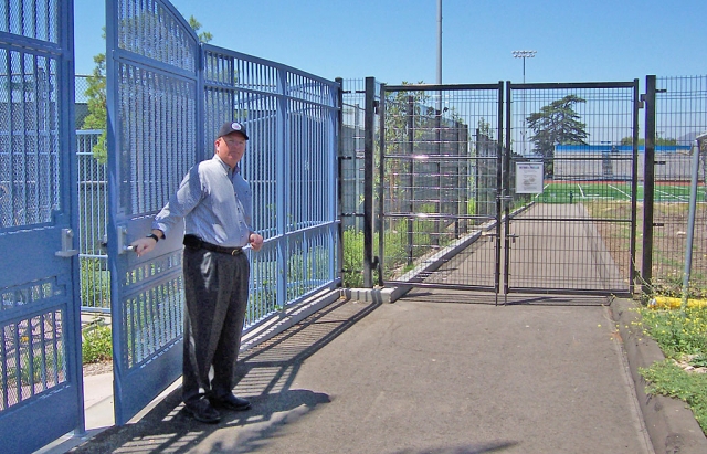 Assistant City Manager Bill Bartels shows where the public entrance to the all-weather track will be for those wishing to jog. A new agreement between the school district and city hall has made this long-awaited event happen.