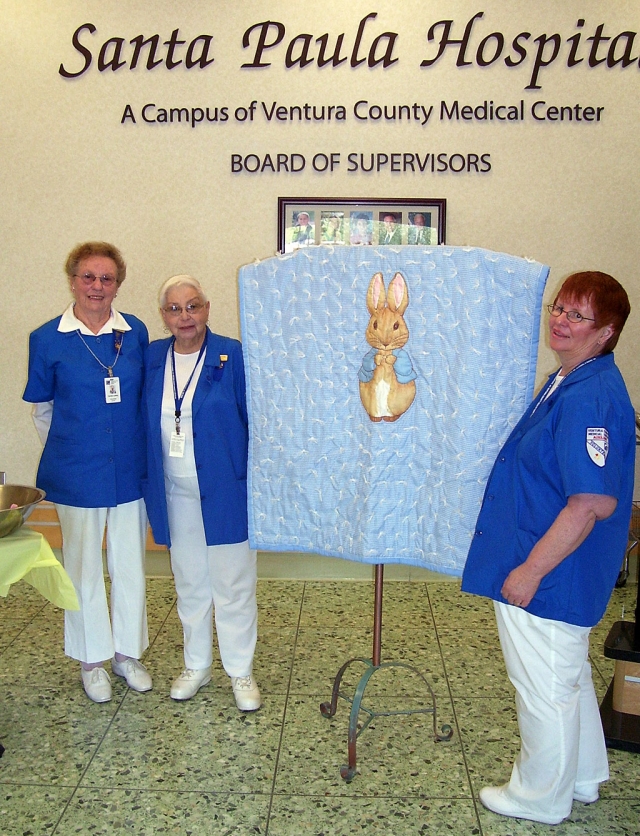 The Santa Paula Hospital Auxiliary Sewing Committee held an opportunity drawing, with this beautiful quilt as the prize. Shown are Auxiliary members Carolyn Laskey, Jane Duchacek and Marilyn Marson, all of Fillmore, who worked three hours every Monday to create gift items for SPH patients and their families. Marivel Avila was the winner of the drawing.