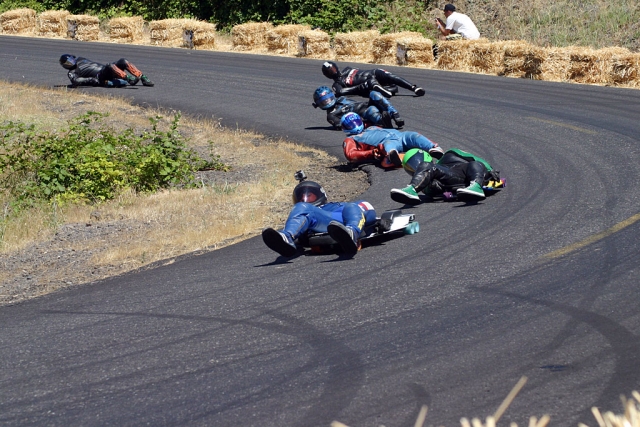 Christian Conaway (in blue and white leathers) and Kyle Castenada (black and green leathers) leading Chris Hicks, Kolby Parks, Will Myrvold and Frank Williams through Cowzers Corner.