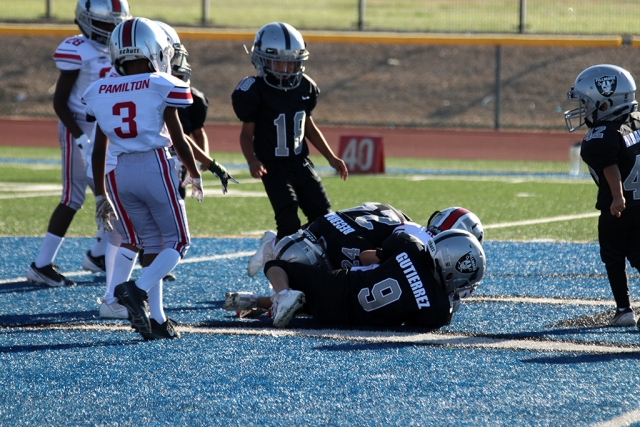 On Saturday, August 28th, at Fillmore High School, the Fillmore Raiders Mighty Mites took on Valley Rush. Above is a group of Raiders making a group tackle at Saturday’s game. The Mighty Mites lost to Valley Rush (30-0). Photos Courtesy Crystal Gurrola.