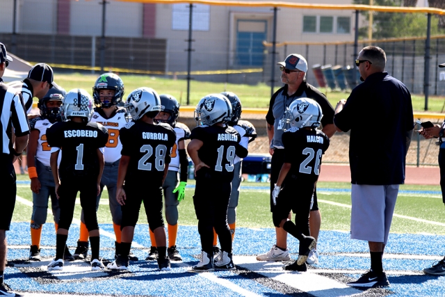 Raiders Bantams’ captains meeting at the 50yard line for the coin toss in their game against Simi Valley. The Bantams lost to Simi Valley (36-6). 