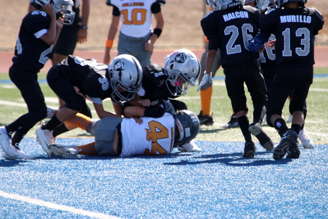 Bantams players making the tackle.