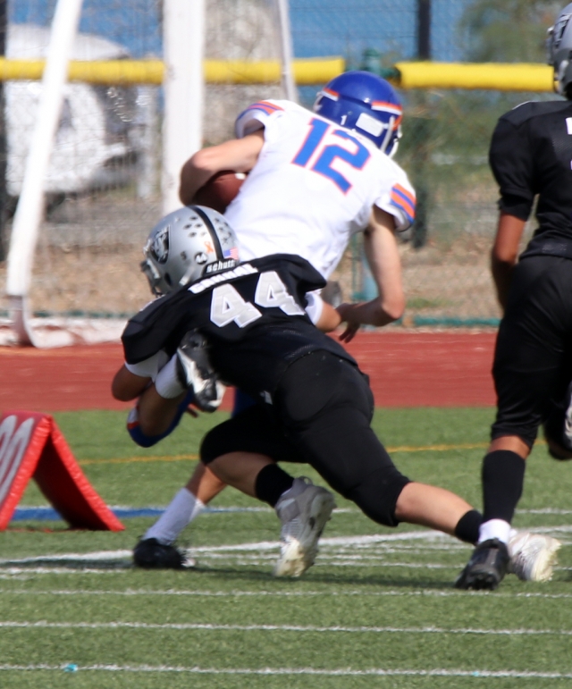 Raider’s senior number #23 leaps into the air as he tries to snatch the ball from a Warriors player this past Saturday, September 25th. 