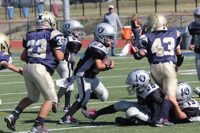 #23 from the Bantams Black Raiders runs the ball up the field. Raiders lost 14-6 against the Santa Clarita Wildcats.