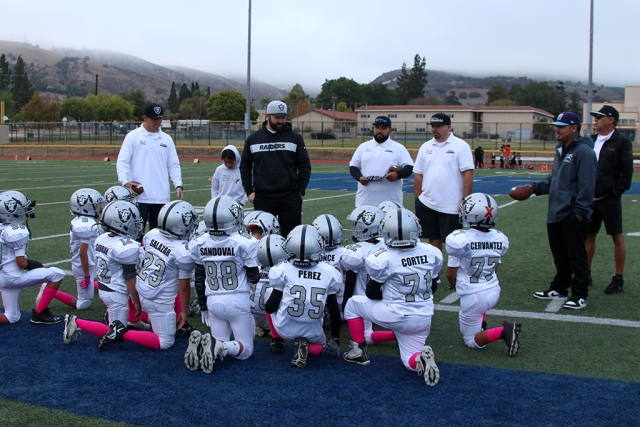 Fillmore Raiders Mighty Mites team as they huddle together after their game against the Thimsha Bengals, which was forfeited by the other team giving the Raiders a win for the week. 