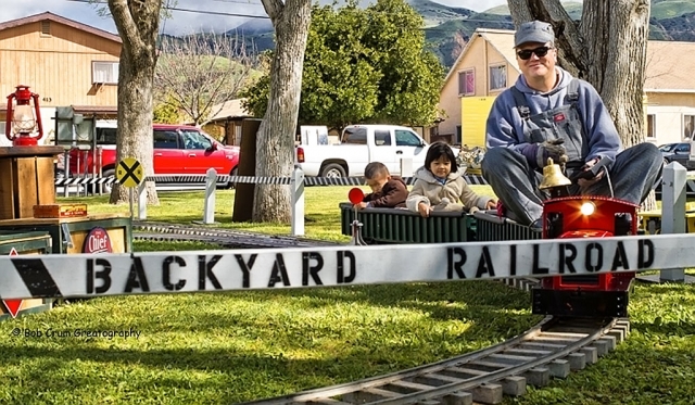 Eizn, 4 and Justin, 3, of Temple City...enjoying a speedy ride on the Backyard Railroad Company train engineered by John Hoefler, CEO.