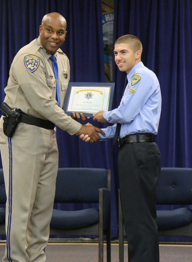 Kyle Ramirez is a local 17 year old, soon to be Senior of Fillmore High School. In his free time he has joined the California Highway Patrol Cadet/Explorer program located at the Moorpark station. The California Highway Patrol’s Explorer Program is for young men and women, 15
to 21 years of age, allowing them to develop the skills and knowledge needed to serve the people through discipline and commitment. Explorers are able to assist the CHP both in office and out in the field but also participate in physical fitness training, medical training, organizational, and clerical training. Kyle was able to attend a week long academy at the CHP training facility located in Sacramento. There he joined 43 other explorers that came from all over California. Kyle and the other explores went through a hell week where they were all put through extensive classroom training and physical fitness challenges to push their limits. The program is a crash course of the real life academy setting and holds them all to the same standards. All 44 explores graduated the 6 day program and preformed all physical and mental tests required of them. At the end of the program Kyle received a badge and a completion certificate and is allowed to return for level four at 19 if he chooses to continue in this program. Photo courtesy of Sebastian Ramirez.