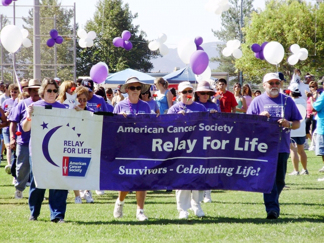 Above, survivors of cancer walk the first lap of the Relay for Life. The event was held at Shiells Park last Saturday, September 26. Relay for Life is a 24 hour event to help raise money and awareness for all cancers. (Photos courtesy of Kathy Arias)
