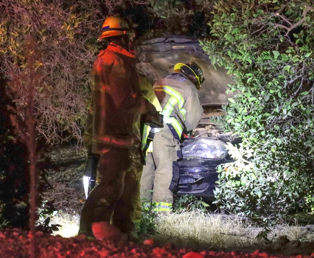 On Saturday, October 15th, 2022, Ventura County Fire Department, AMR, and California Highway Patrol were dispatched to a heavy rescue crash at Sr23/Chambersburg Road and Riverside Avenue, Bardsdale. Arriving firefighters reported a single vehicle inside the orchards with moderate damage, single occupant. According to firefighters one person was being treated by AMR Paramedics on scene and was transported to a local hospital, condition unknown. Cause of the crash is under investigation. Photo credit Angel Esquivel-AE News.