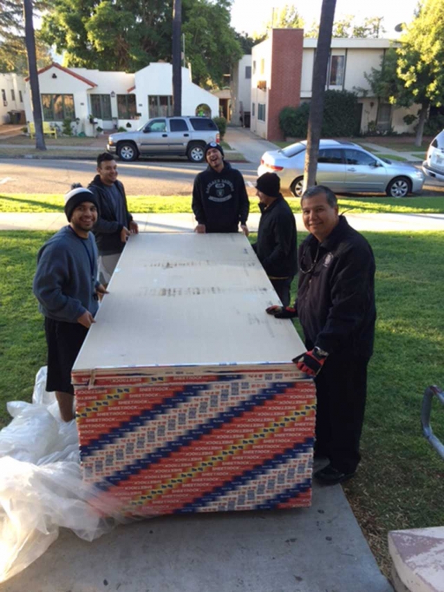 November 4, 2015, Chief Landeros helped Boys & Girls club staff move sheets of drywall to their soon to be finished Teen Study Center.
