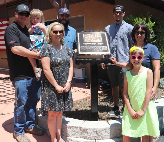 On Saturday, July 1st, family, friends, and community members gathered for the Reguberto “Rigo” Landeros Street Renaming and Plaque Unveiling which took place at the Fillmore Fire Station. The City renamed a portion of Sespe Avenue to honor the memory of Chief Landeros. Pictured above is Rigo’s family standing next to the plaque that is outside the Fillmore Fire Station, (l-r) son-in-law Elden Bingham holding Mia with Rigo’s daughter Christina, front. Sons Daniel and David, with Rigo’s wife Laura and grand-daughter Gabbie Bingham. Photos courtesy Fillmore Fire Department.