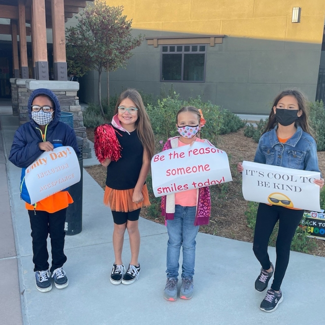 On Wednesday, October 20th, Fillmore Unified School District wore orange to promote Unity Day to prevent bullying and promote kindness. Pictured are members of Rio Vista Kindness Squad greeting students on Unity Day. Photo courtesy Rio Vista School website.