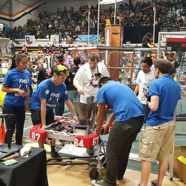 After a very productive round the Flashes team carry “Mr. Roboto,” off the field and back to the pit.