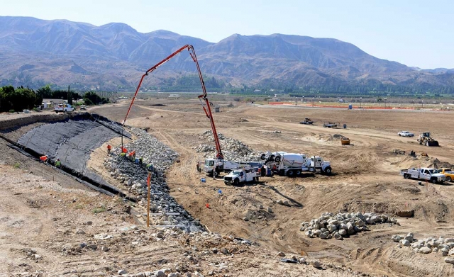 Rip-rapping the Pole Creek flood basin is a big job. Rock is being placed along the face of the basin to avoid erosion.