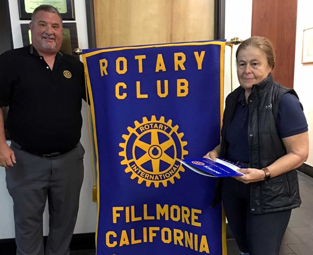 Fillmore Rotary Club President Dave Wareham initiated the newest Rotarian, Barbara Filkins. Photo Courtesy Martha Richardson.
