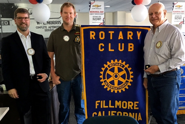 President Andy Klittich, center, awarded Sean Morris and Dick Richardson Paul Harris Fellow pins. Paul Harris recognition acknowledges individuals who contribute, or who have contributions made in their names of $1,000 to the Rotary Foundation. Over the years Sean has received four awards and Dick has received two. Photo courtesy Martha Richardson.