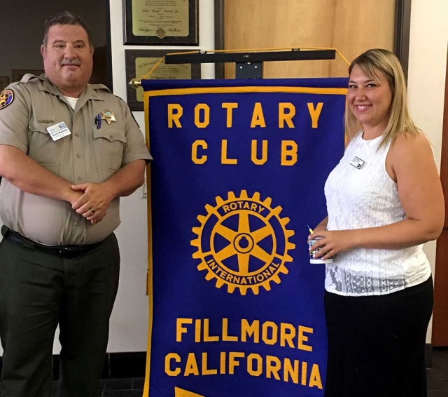 Rotary President Dave Wareham presented a Rotary mug to speaker, Caitlin Barringer, from the American Cancer Society. She spoke about the upcoming Relay for Life which will be held September 23rd and 24th. Photo courtesy Martha Richardson.