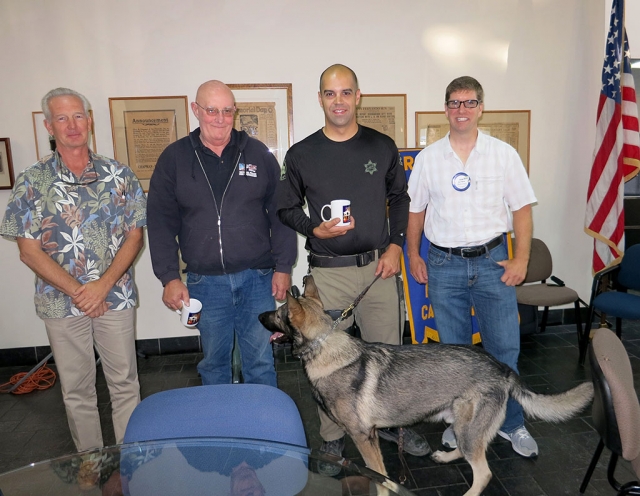 The Rotary Club enjoyed a program presented by Dave Inglis, retired Ventura Police Officer and canine trainer and Norm McDaniel. He informed the Club about the National Police Dog Foundation. Deputy John Carver told about his dog, Tommy and what is involved in owning and working with a police dog. Pictured are Norm McDaniel, Dave Inglis, John Carver, Sean Morris and Tommy.