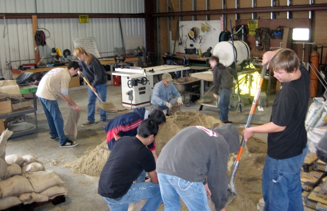 The Boy Scout motto is “Be Prepared” so on Monday morning Boy Scout Troop 406 had over 23 Scouts and friends turn out to fill sand bags just in case the rain this week starts to overrun the community. In 2 hours the Scouts and Fillmore firemen filled 14 pallets with 700 sand bags. We hope that they won’t be needed, but if they are, we were prepared. The bags will be used by the Fillmore Fire Department for emergency use throughout the community. Submitted by Scott Klittich.