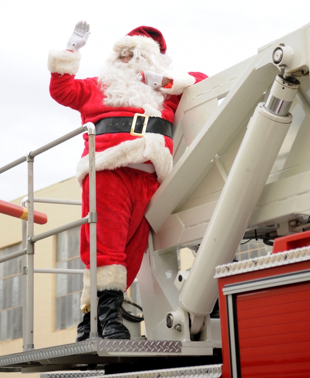 HoHoHo!! Santa was right on time for the Annual Fillmore Fire Dpartment Toy Giveaway, held December 18th. He arrived in style on Engine 91, waving to the waiting crowd. A picture on Santa’s lap and candy cane, show above, was just one of the celebrations of the season. Each child received a wrapped gift, cotton candy and more. Besides Fillmore Fire, the Ventura County Sheriffs Dept., Fillmroe City council members, the CHP and American Medical Response were on-hand. The line for the event snaked down the street, but it was worth the wait.