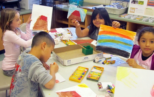 Mountain Vista students, Noe Magana, Jayden Brandt, Angela Perez, and Alix Tirado show off their art projects. The Mountain Vista Art program is fully funded through a donation from Owens and Minor.