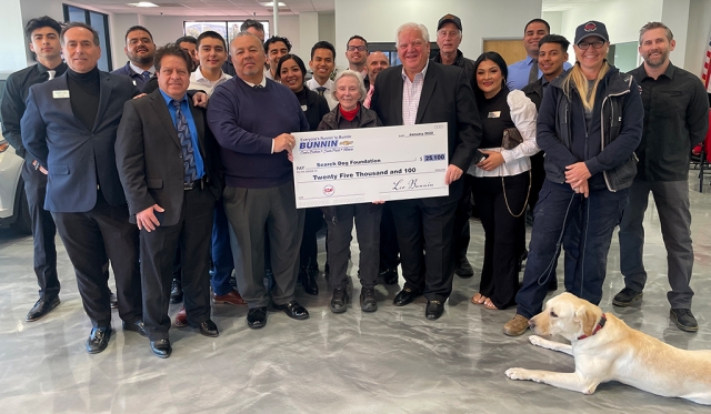 On Friday, February 23rd, Bunnin Chevrolet presented a check to Search Dog Foundation rescue dog, Stryker. Leo Bunnin, owner of Bunnin of Santa Paula, Fillmore and Santa Barbara, presented the check for $25,100 to Wilma Melville (center), founder of Search Dog Foundation of Santa Paula. Both Leo and Wilma are surrounded by SDF executives and the Bunnin Chevrolet sales team that helped make the donation possible. Photo credit Shane Morger, Bunnin Chevrolet of Fillmore.