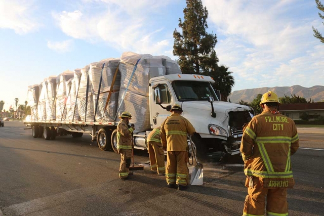 At approximately 6:00am Saturday Fillmore Fire Department responded to a collision at the intersection of Ventura and B Streets. Two semi-trucks collided causing one truckload to shift; no injures were reported. As of 10:00am westbound Ventura Street was still partially blocked. Photos courtesy Sebastian Ramirez