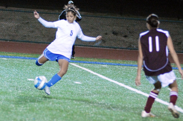 Gloria Elias #5 kicks the ball down the field to keep it away from Santa Paula. Fillmore played Santa Paula
last Friday night, but lost 0-7.