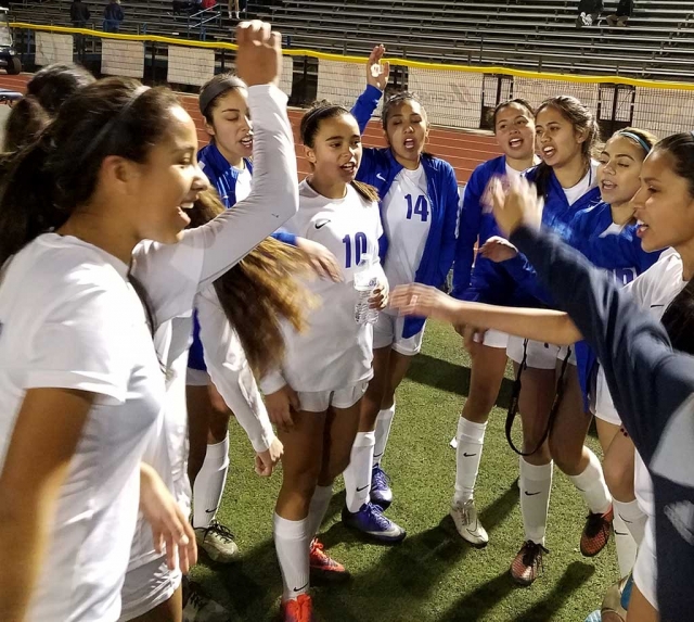 Lady Flashes celebrate after their victory.