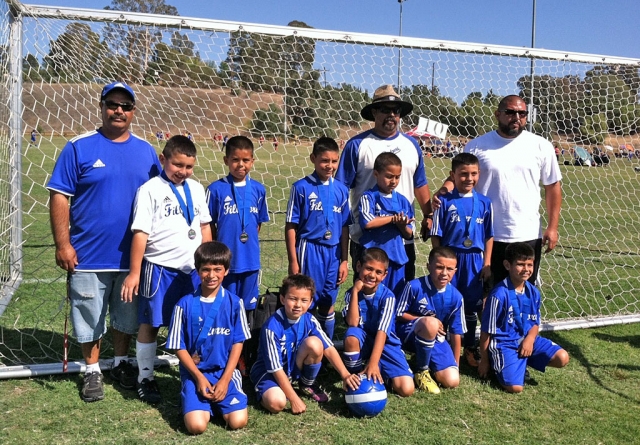 In the Thousand Oaks Memorial Day Tournament, Fillmore boys U-8 team played a U-9 team and took home second place. (l-r) (bottom row) Jathan Magana, Adrian Vasquez, Mathew Magana, Julio Negrete, Diego Alcaraz, (top row) Ivan Becerra, Angel Castorena, Armando Manriques, Alfredo Cardenas, and Dante Reyes. (not pictured) Sebastian Navarrete. Coaches are Joe, Damian and Javier.