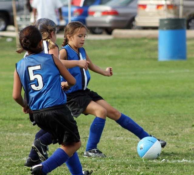 Aviana Ramirez #9 and Denise Santa Rosa #5 fight for the ball.