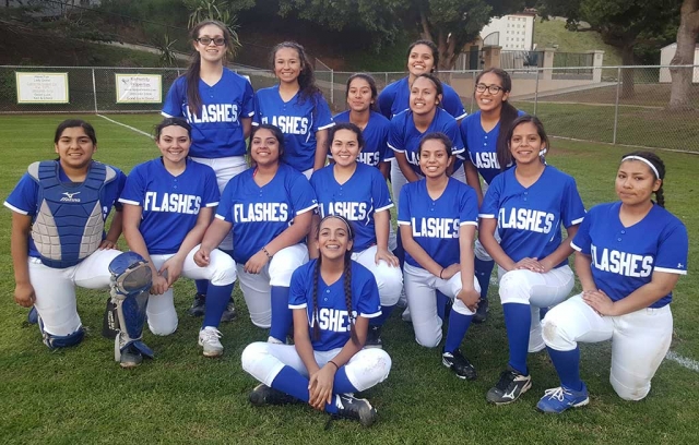 Fillmore Flashes J.V. Softball Team smiles for a photo at their first game of the 2017 season against Santa Barbara High School.