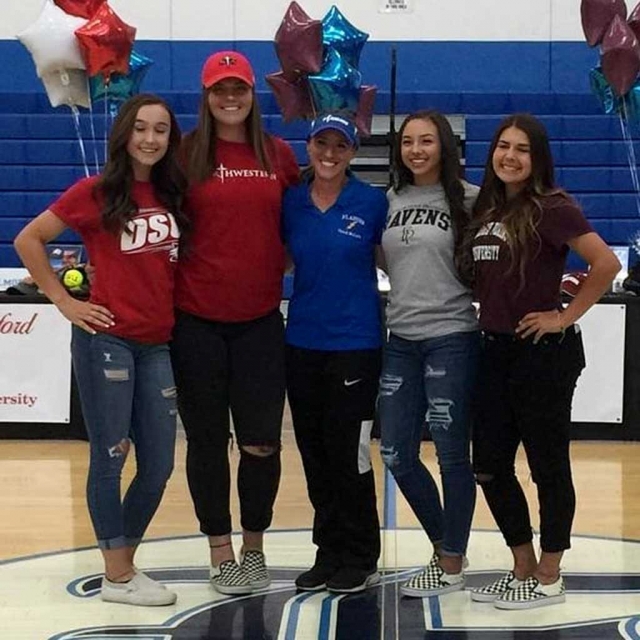 (l-r) Kasey Crawford, Sydnee Isom, FHS Softball Coach Kellsie McLain, Maiah Lopez and Cali Wyand smile for a photo after signing their National Letter of Intent to continue their education and softball careers at the college level. Photos courtesy Carina Crawford.