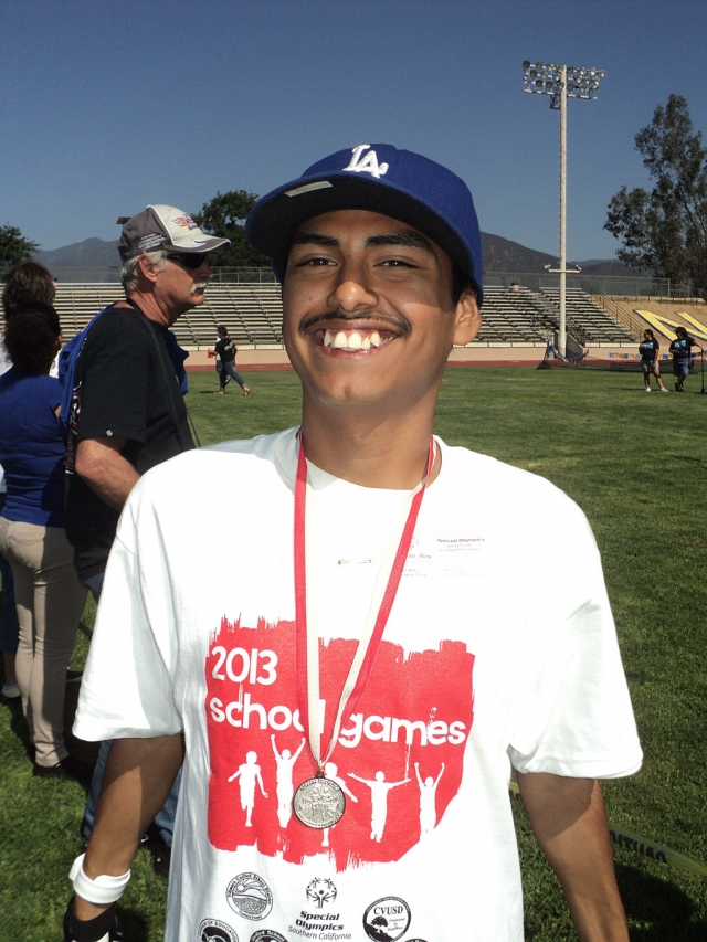 Alex takes a silver in the softball throw