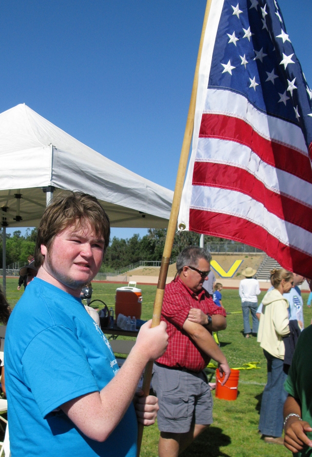 Jacob Gaither held the American Flag in the opening ceremony.