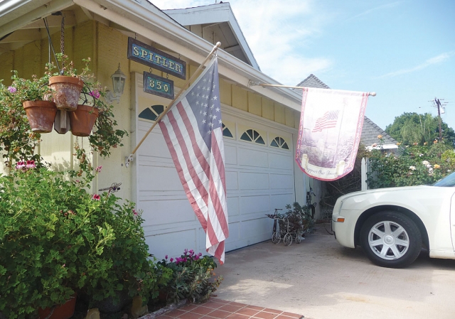 An American Flag and Support our Troops flag are hung in front of the Spitler home in honor of our Veterans.